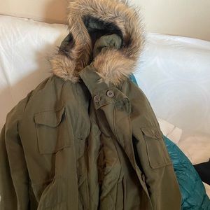 Army green jacket with faux fur around hood quilted inside